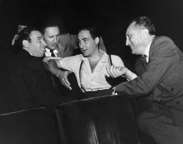 Some of the crew of the NBC comedy sketch program "Your Show of Shows" in 1952. On the far left is writer Mel Brooks, at center is the show's star, Sid Caesar, and Hal Janis, in charge of network liaison, is seated far right.<p><a href="https://www.gettyimages.com/detail/82018319" rel="nofollow noopener" target="_blank" data-ylk="slk:Pictorial Parade/Getty Images;elm:context_link;itc:0;sec:content-canvas" class="link ">Pictorial Parade/Getty Images</a></p>