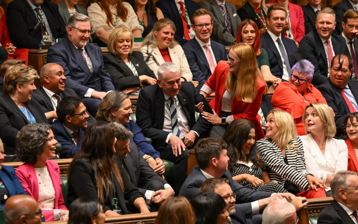 The Speaker Sir Lindsay Hoyle is helped to his chair in the traditional way