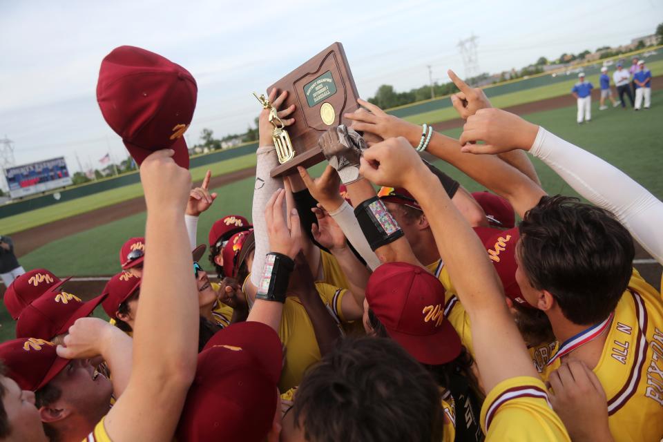 North players hoist the district championship trophy after a 3-2 win over Central Crossing in a Division I district final May 25 at Olentangy Liberty. The Warriors lost 9-2 to 2021 state champion New Albany in a regional semifinal June 3 at Dublin Coffman.