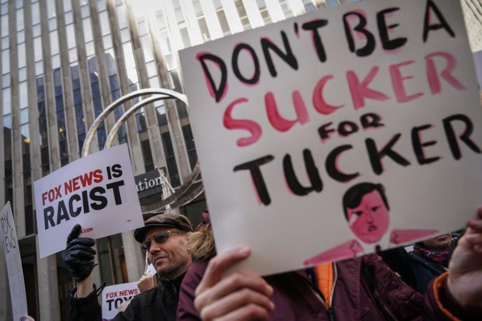 Protesters rally against Fox News outside its headquarters in New York, New York, on 13 March 2019.