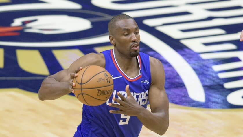 Los Angeles Clippers center Serge Ibaka (9) dribbles in the first half of an NBA basketball game.