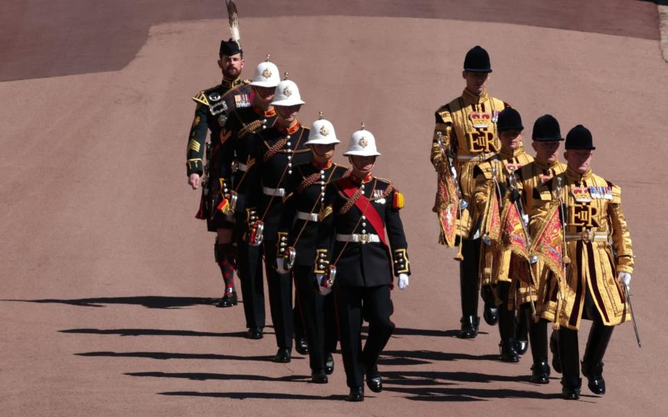 Members of the military march outside St George's Chapel, Windsor Castle, - Hannah Mckay/PA