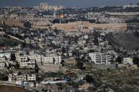 The East Jerusalem neighborhood of Silwan is seen in the foreground as the Dome of the Rock on the compound known to Jews as Temple Mount and to Palestinians as Noble Sanctuary in Jerusalem's Old City is seen in the background