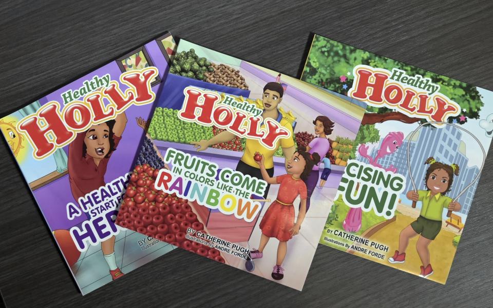 FILE - In this March 2019 file photo, copies of then-Baltimore Mayor Catherine Pugh's self-published "Healthy Holly" illustrated paperbacks for children are seen in Baltimore. Pugh is expected to plead guilty to perjury. A plea hearing on the state misdemeanor charge is scheduled Friday in Anne Arundel County Circuit Court in Annapolis. Pugh already has been sentenced to three years in federal prison from the self-dealing scandal. (Jerry Jackson/The Baltimore Sun via AP, File)