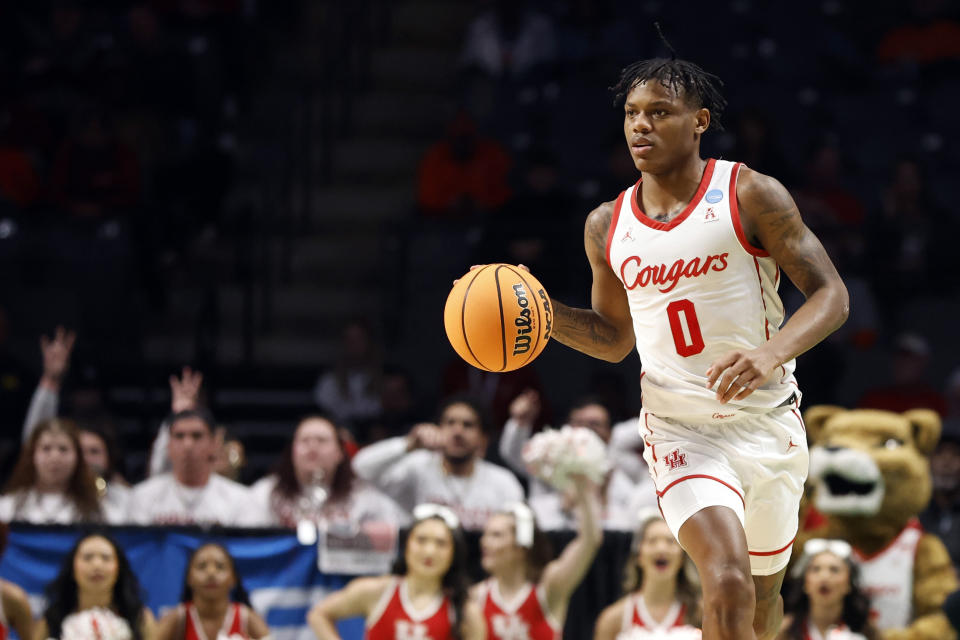 Houston guard Marcus Sasser brings the ball up duirng the first half of the team's first-round college basketball game against Northern Kentucky in the men's NCAA Tournament in Birmingham, Ala., Thursday, March 16, 2023. (AP Photo/Butch Dill)