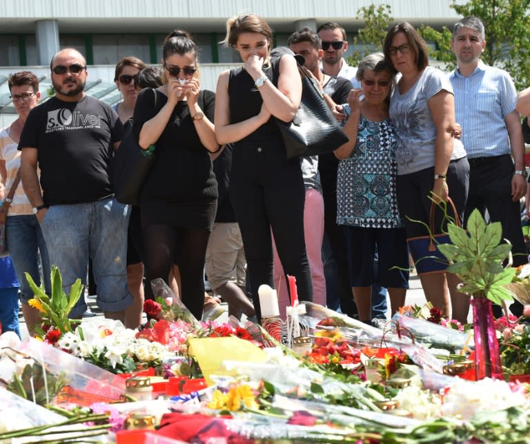 On July 24, 2016 in Munich, people mourn the victims of the shooting spree that killed nine people