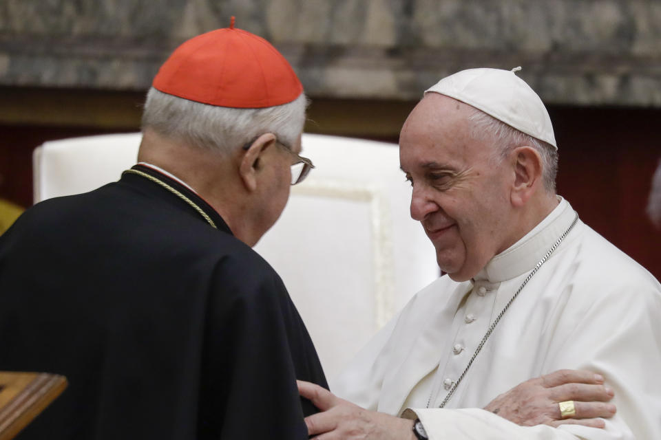 Pope Francis exchanges greetings with Cardinal Angelo Sodano, left, on the occasion of the pontiff's Christmas greetings to the Roman Curia, in the Clementine Hall at the Vatican, Saturday, Dec. 21, 2019. (AP Photo/Andrew Medichini, Pool)