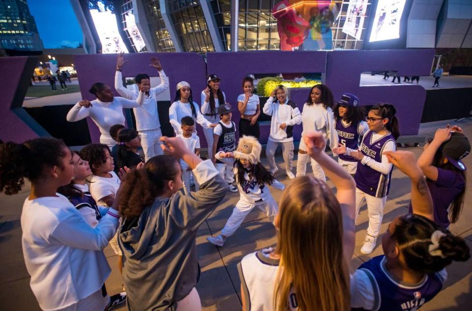 Melody Eller, 9, wears a lion hat while freestyle dancing in a circle of fellow dancers with Balance Dance Project, directed by Heather Singleteary, at DoCo during the NBA basketball game between the Sacramento Kings and the Golden State Warriors on Friday, April 7, 2023, at Golden 1 Center. Excitement for the Kings’ last home game of the regular season was only eclipsed by anticipation for the team’s first playoff berth in 16 years.