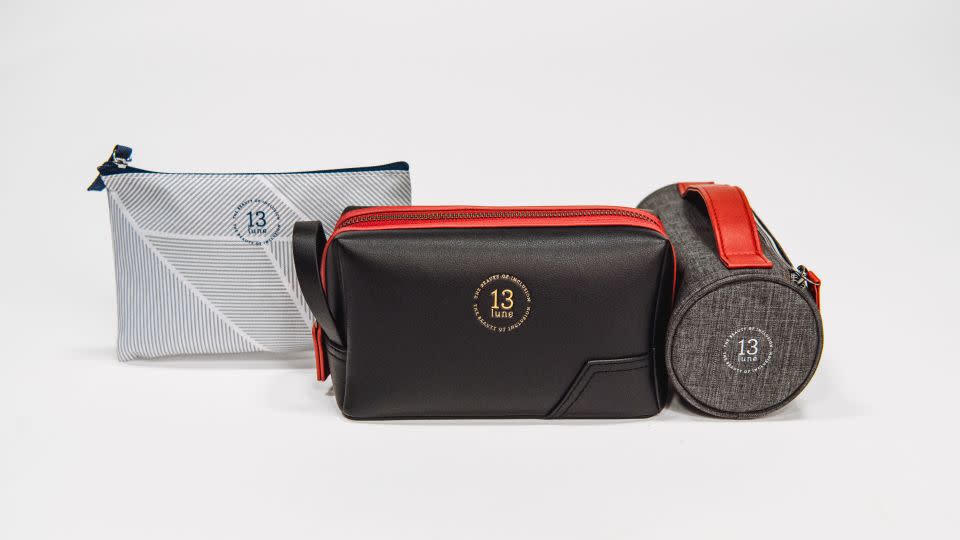 American Airlines’ new limited-edition Thirteen Lune premium economy, Flagship First and Flagship Business amenity kits (left to right). - American Airlines