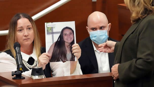 PHOTO: Lori Alhadeff holds a photograph of her daughter, Alyssa, as she and her husband, Ilan Alhadeff, give their victim impact statements during the penalty phase of the trial Nikolas Cruz at the Broward in Fort Lauderdale, Fla., Aug. 2, 2022. (Amy Beth Bennett/Pool via Reuters)