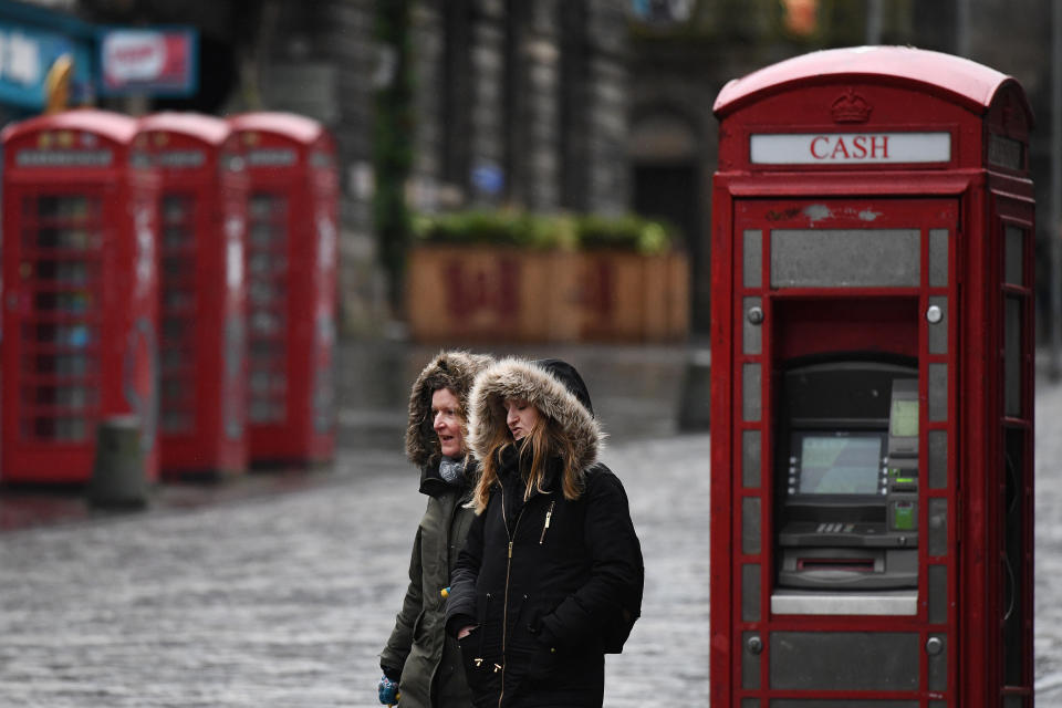 EDINBURGH, SCOTLAND - JANUARY 04: Members of the public walk through a deserted Edinburgh City Centre on January 4, 2021 in Edinburgh, Scotland. The Scottish Parliament will be recalled this afternoon to consider further coronavirus measure in an attempt to tackle the rapid increase in cases.  (Photo by Jeff J Mitchell/Getty Images)