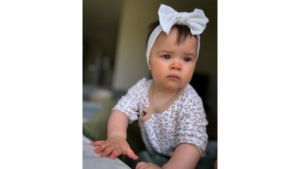 baby girl wearing white hair bow