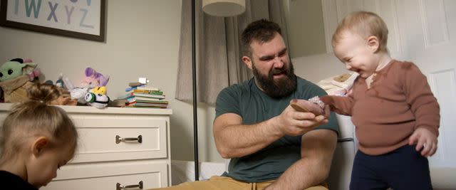 <p>Amazon Studios</p> Jason Kelce playing with daughters