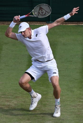 Kevin Anderson returns to Gael Monfils during their fourth round match at Wimbledon
