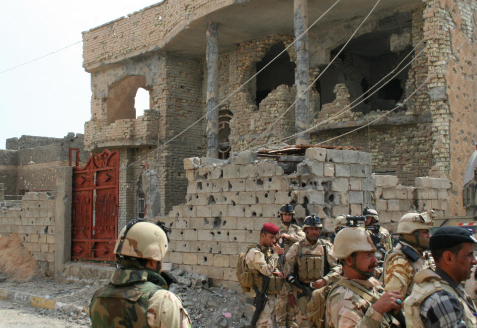 In this photo released by the Iraqi Army taken on March 20, 2014, Iraqi Security forces deploy after clashes with militants in Ramadi, 70 miles (115 kilometers) west of Baghdad, Iraq. This grueling urban warfare in the Ramadi suburb of al-Bakir, witnessed by an Associated Press reporter, is part of a deadly standoff pitting government forces and allied tribal militias against the Islamic State and allied rebels in Anbar province, the heartland of Iraq’s Sunni minority. They hold part of the provincial capital Ramadi and nearly all of nearby city of Fallujah.(AP Photo/Iraqi Army)