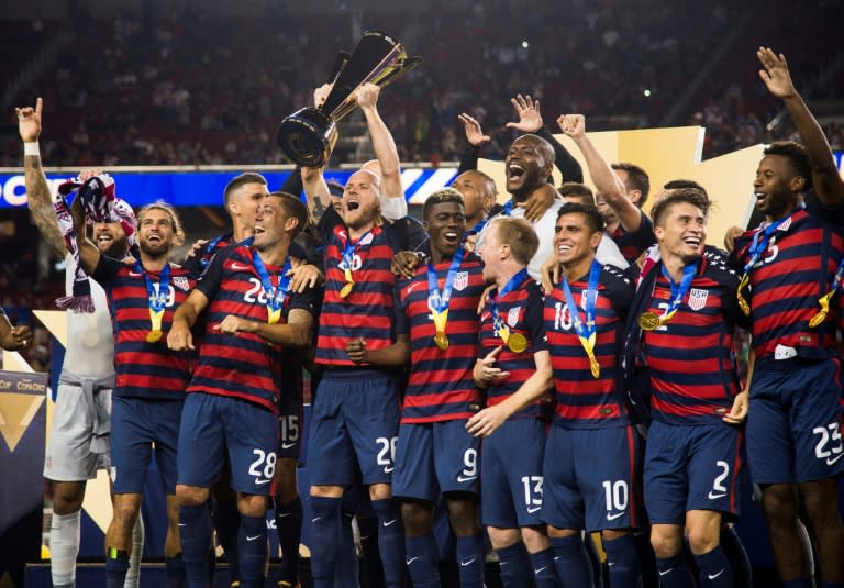 Team USA captain Michael Bradley holds the trophy as he celebrates with teammates after defeating Jamaica 2-1 in the 2017 CONCACAF Final, at Levi's Stadium in Santa Clara, California, July 26