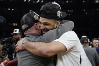 Denver Nuggets guard Jamal Murray, right, is hugged by head coach Michael Malone after Game 4 of the NBA basketball Western Conference Final series against the Los Angeles Lakers Monday, May 22, 2023, in Los Angeles. (AP Photo/Ashley Landis)