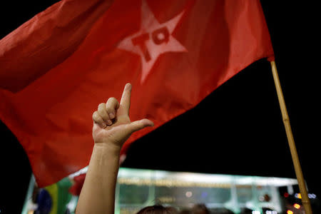 A supporter of Brazilian Workers Party gestures during a protest against President Michel Temer, in front of Planalto Palace, in Brasilia, Brazil, April 17, 2017. REUTERS/Ueslei Marcelino