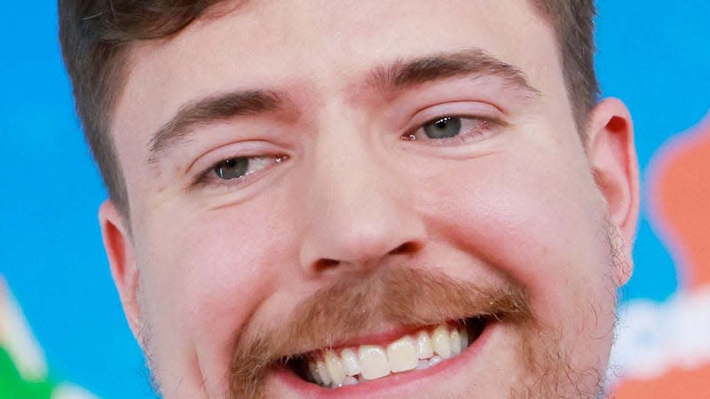 An image shows MrBeast smiling like a normal human man. 