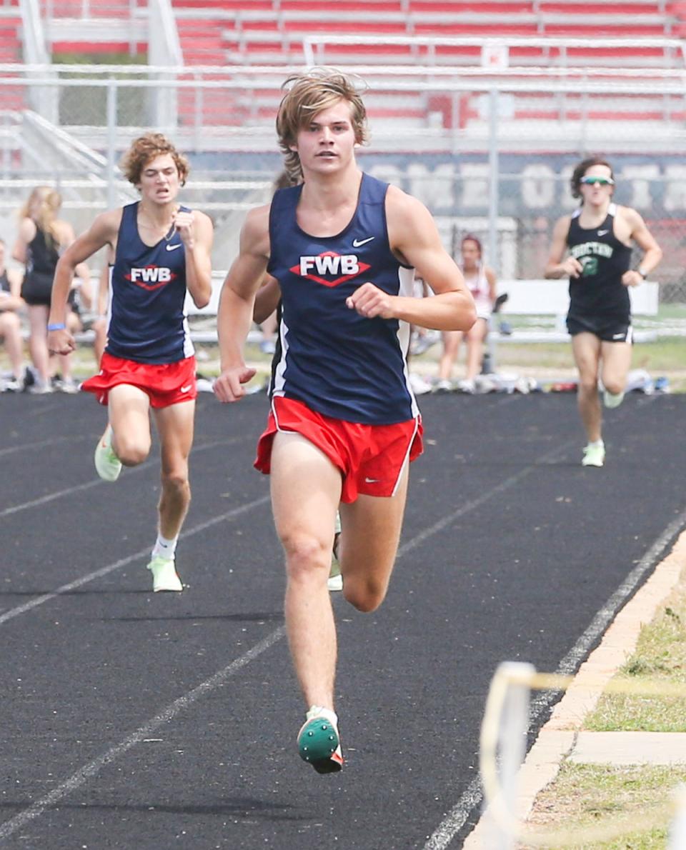 Luke Larkin of Fort Walton Beach approaches the finish to win the boys varsity 800 meter run during the Okaloosa County Track and Field Championship held at Fort Walton Beach High School.