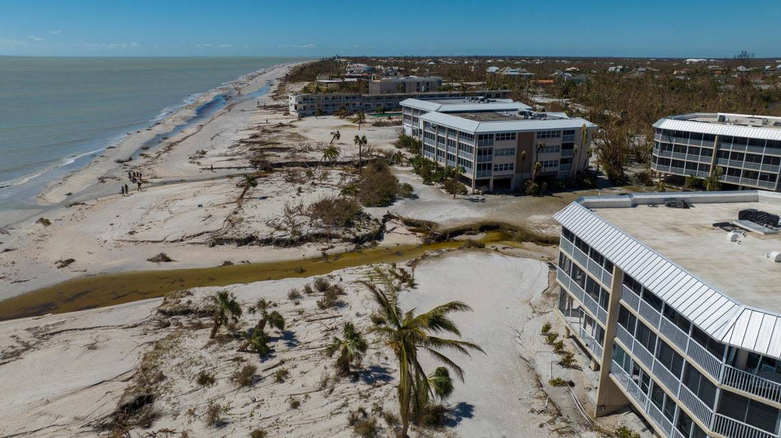 Damaged condominiums are seen along the beachfront after Hurricane Ian passed by the area, Friday, Sept. 30, 2022, in Sanibel Island, Fla. (AP Photo/Steve Helber)