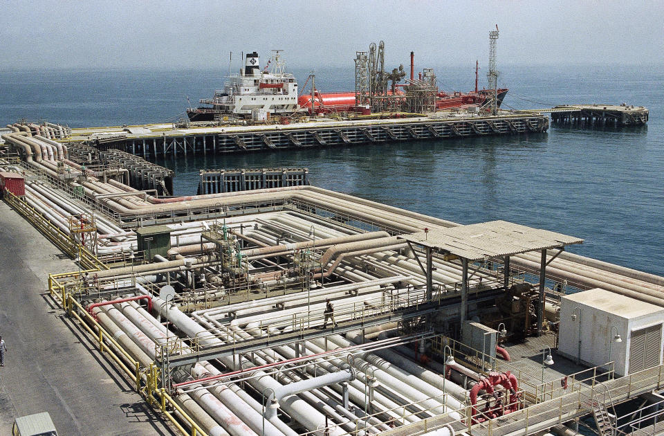 FILE - In this Sept. 25, 1990 file photo, oil pipelines snake through the port area of the Aramco facility at Ras Tannura, Saudi Arabia. Saudi Arabia’s renewed push to publicly list its most valuable entity, Aramco, is part of a high-stakes plan by Crown Prince Mohammed bin Salman to prepare the country for a future less dependent on oil for survival. (AP Photo/Tannen Maury, File)