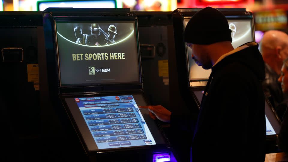 A gambler enters his bet during the launch of legalized sports betting in Michigan at the MGM Grand Detroit casino in Detroit, Wednesday, March 11, 2020. - Paul Sancya/AP