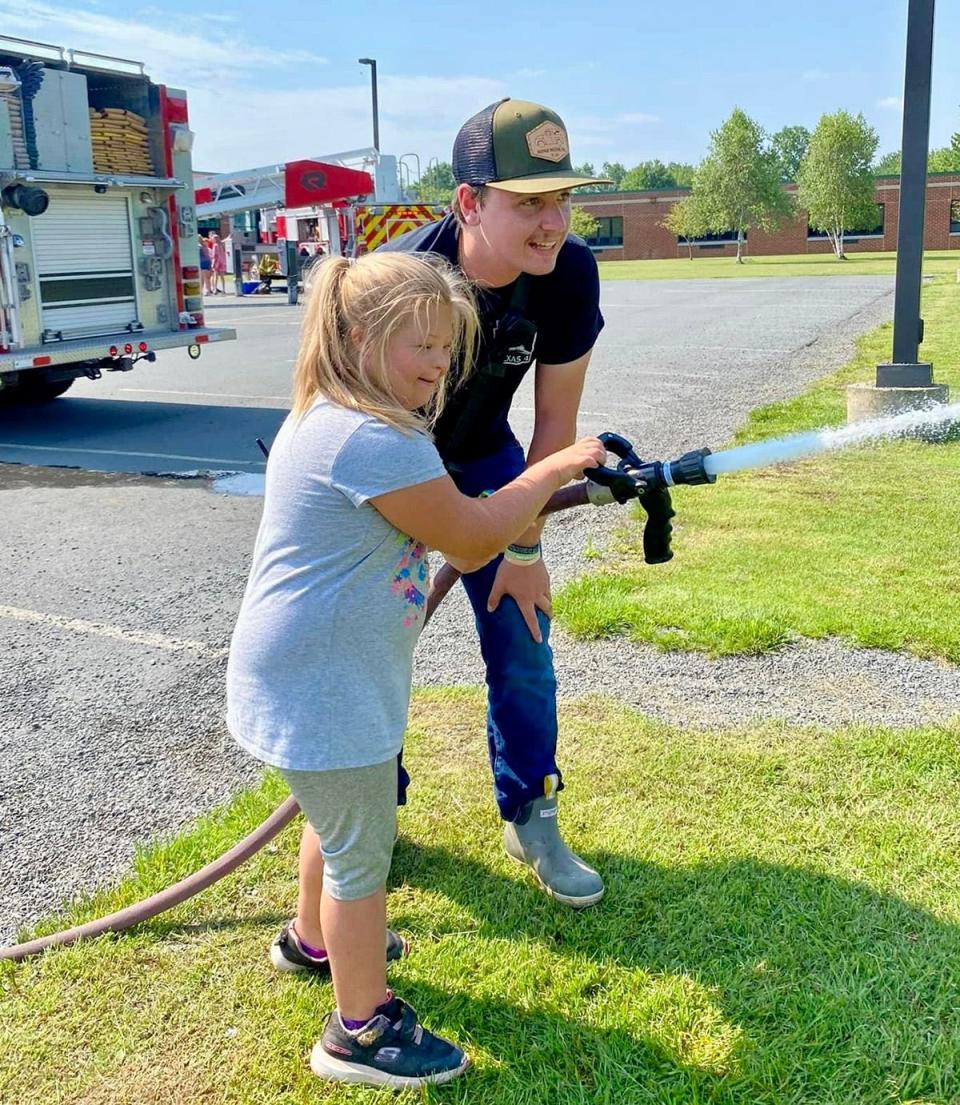 Volunteer fire fighter Danny Becker is a Lieutenant with Texas No. 4 in Honesdale. He's shown here working with youngsters at the Dyberry Day Camp.