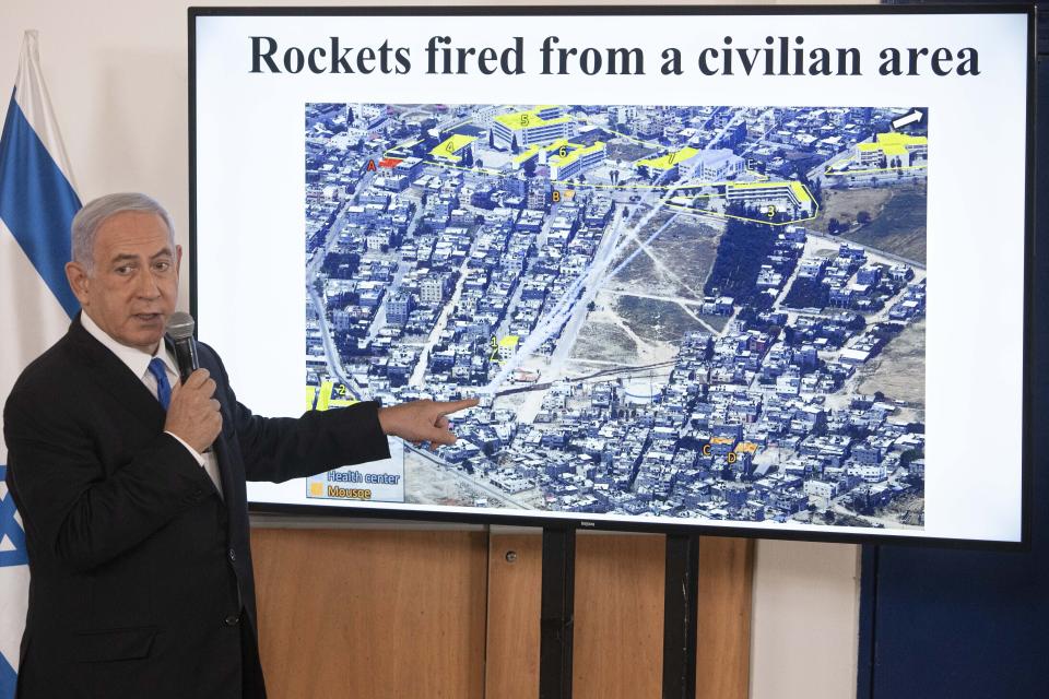 FILE - In this May 19, 2021, file photo, Israeli Prime Minister Benjamin Netanyahu gestures as he shows a slideshow during a briefing to ambassadors to Israel at the Hakirya military base in Tel Aviv, Israel. Netanyahu's political career seemed all but over, but now, as Israel and Gaza’s Hamas rulers wage war, Netanyahu’s fortunes have changed dramatically. His rivals’ prospects have crumbled, Netanyahu is back in his comfortable role as Mr. Security, and the country could soon be headed for yet another election campaign. (AP Photo/Sebastian Scheiner, Pool, File)