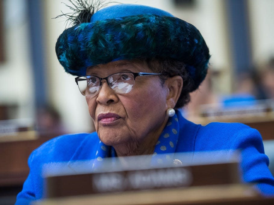 Alma Adams wears a blue hat with a feather in a congressional meeting