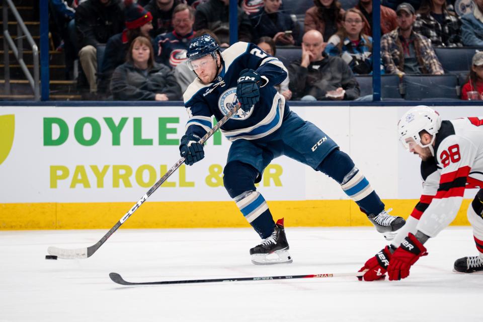 Dec 16, 2023; Columbus, Ohio, USA;
Columbus Blue Jackets right wing Mathieu Olivier (24) attempts to score against New Jersey Devils defenseman Kevin Bahl (88) during the third period of their game on Saturday, Dec. 16, 2023 at Nationwide Arena.