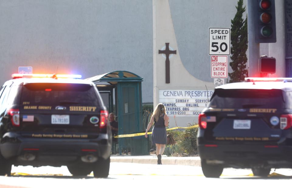 Police vehicles are parked near the scene of a shooting at the Geneva Presbyterian Church on May 15, 2022 in Laguna Woods, California.