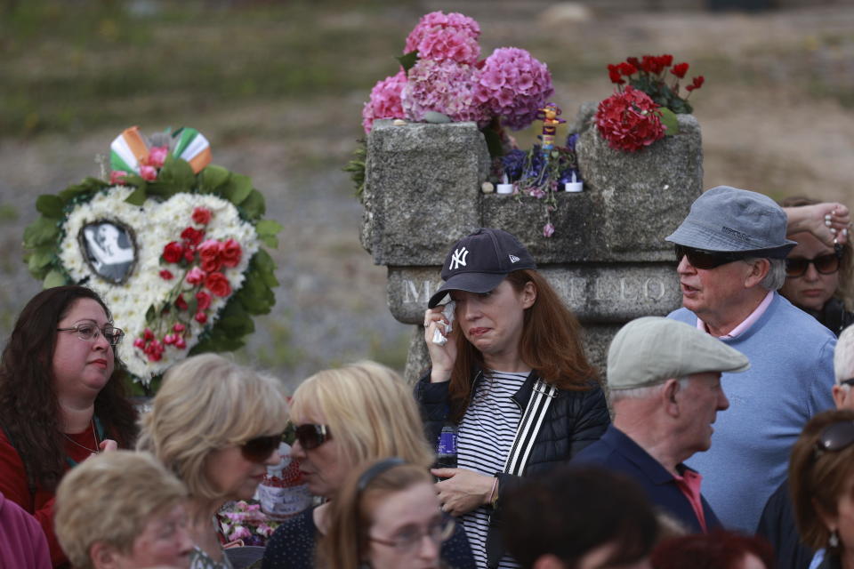 Fans gather outside the former home of Sinead O'Connor ahead of the late singer's funeral, in Bray, Co Wicklow, Ireland, Tuesday, Aug. 8, 2023. O’Connor’s family has invited the public to line the waterfront in Bray on Tuesday as her funeral procession passes by. Fans left handwritten notes outside her former home, thanking her for sharing her voice and her music. (Liam McBurneyPA via AP)