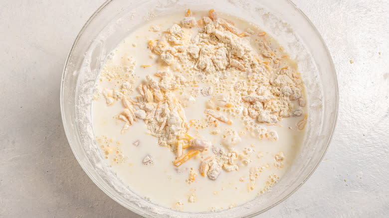 Bowl with dry flour mixture and milk