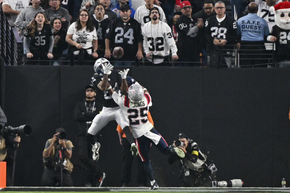 Las Vegas Raiders wide receiver Keelan Cole (84) catches a touchdown pass against New England Patriots cornerback Marcus Jones (25) during the second half of an NFL football game between the New England Patriots and Las Vegas Raiders, Sunday, Dec. 18, 2022, in Las Vegas. (AP Photo/David Becker)