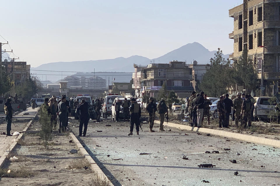 Afghan security personnel gather at the site of an explosion in Kabul, Afghanistan, Wednesday, Nov. 13, 2019. An explosion has rocked the Afghan capital of Kabul as early morning commuters were on the street heading to work. (AP Photo/Rahmat Gul)