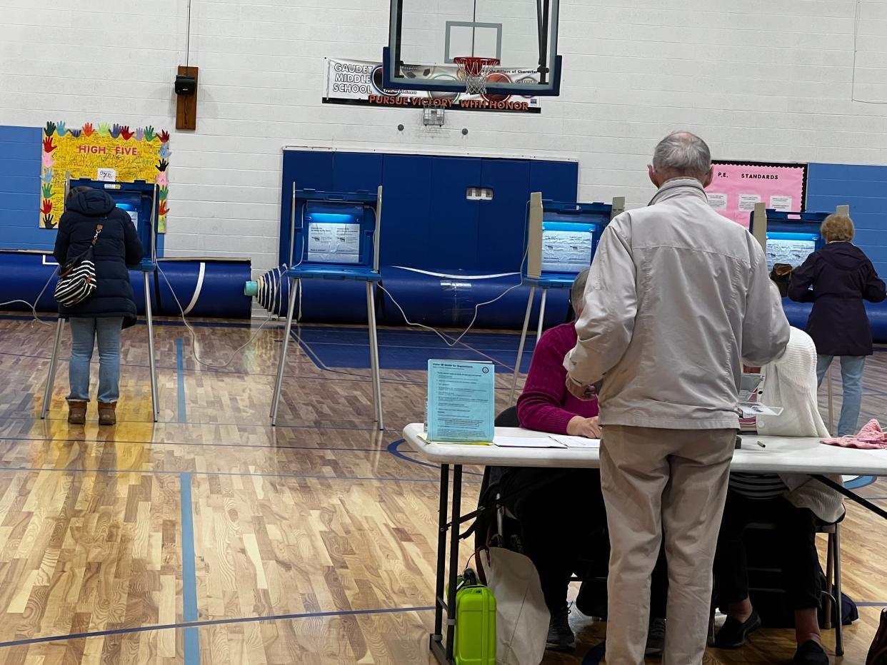 A steady stream of voters cast ballots at Gaudet Middle School in Middletown Tuesday morning.