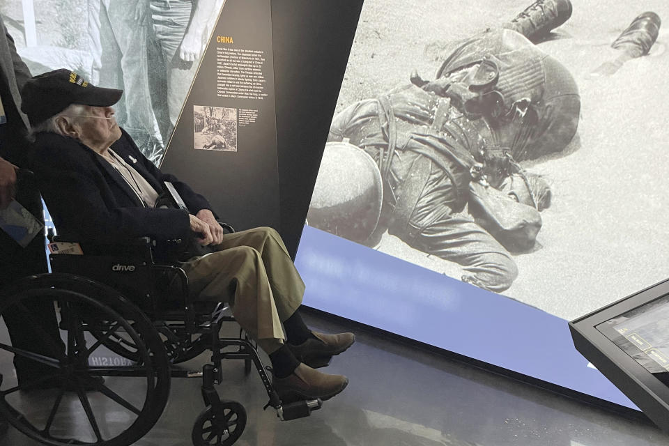 A World War II veteran looks an exhibit at the National WWII Museum's new Liberation Pavilion in New Orleans on Friday, Nov. 3, 2023. (AP Photo/Kevin McGill)