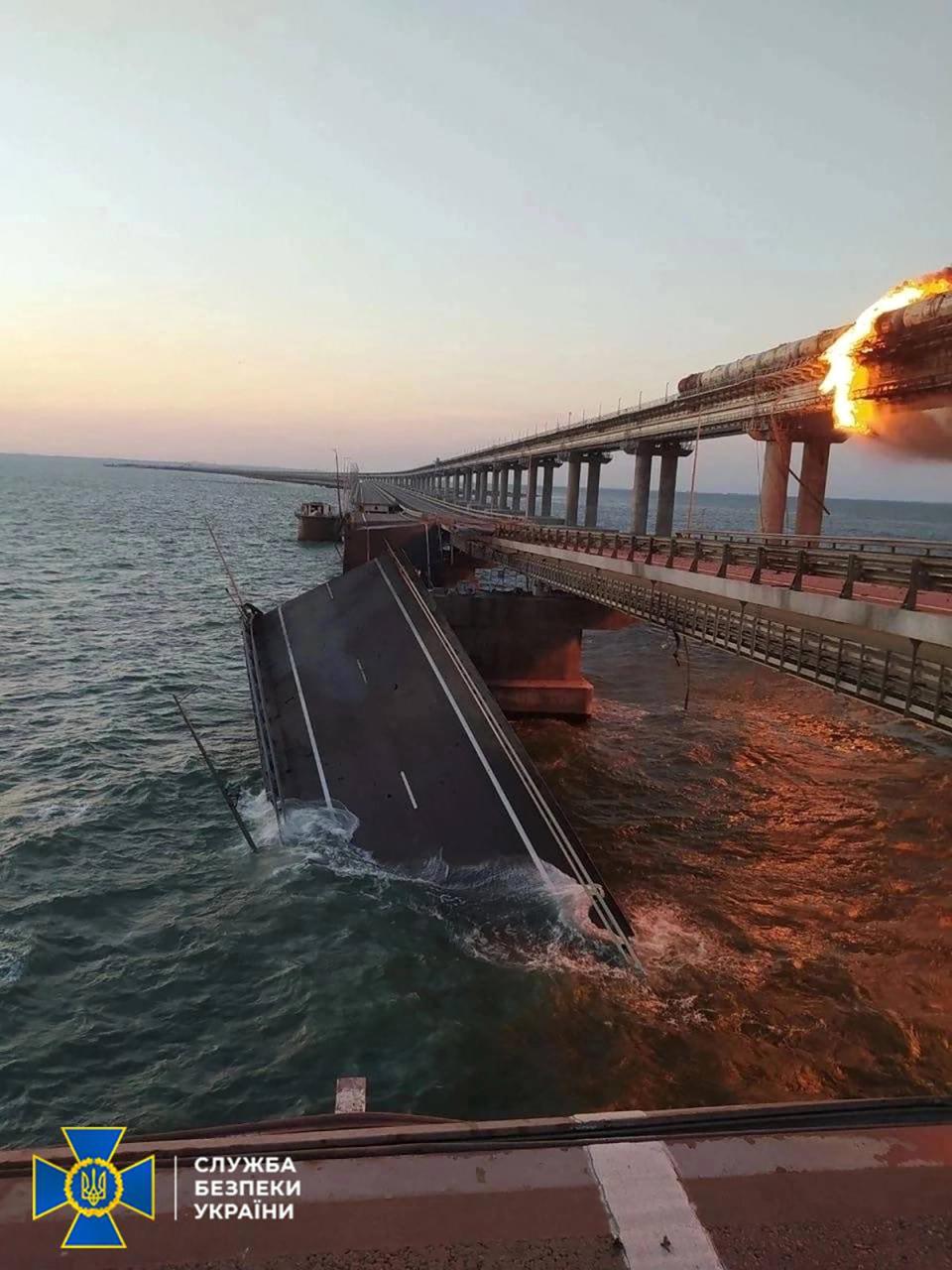 The explosion caused at least three sections of the road to collapse into the water below (SECURITY SERVICE OF UKRAINE/AFP)