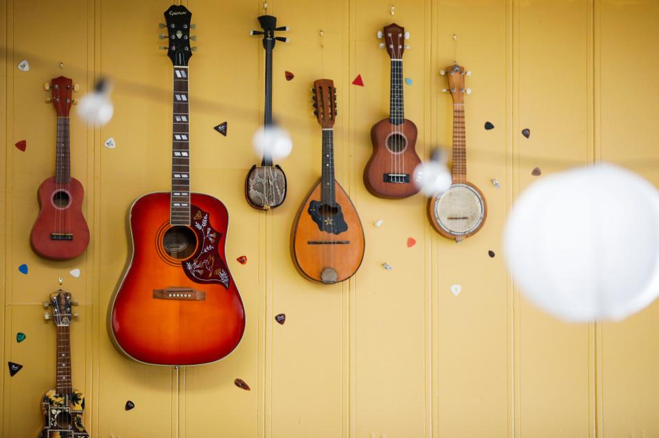 Instruments decorate the walls at The Shoe Tree Listening Room on East St. Louis Street on Thursday, Feb. 8, 2024.