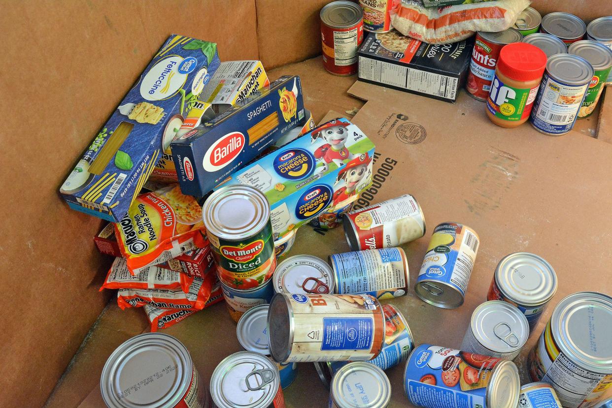 Donations for the Food Bank for Central and Northeast Missouri start to fill a container in August at the Columbia Mall. Mail carriers will collect donations at mailboxes Saturday for the National Association of Letter Carriers Stamp Out Hunger event benefiting the Food Bank.