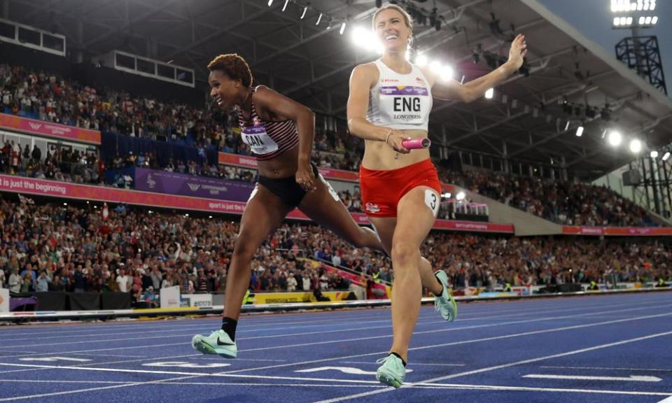 Jessie Knight of England crosses the line fractionally ahead of Canada’s Kyra Constantine to win the 4x400m relay