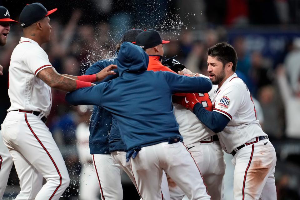 Atlanta Braves left fielder Eddie Rosario (8) celebrates his walk-off RBI against the Los Angeles Dodgers during the ninth inning in Game 2 of the NLCS.