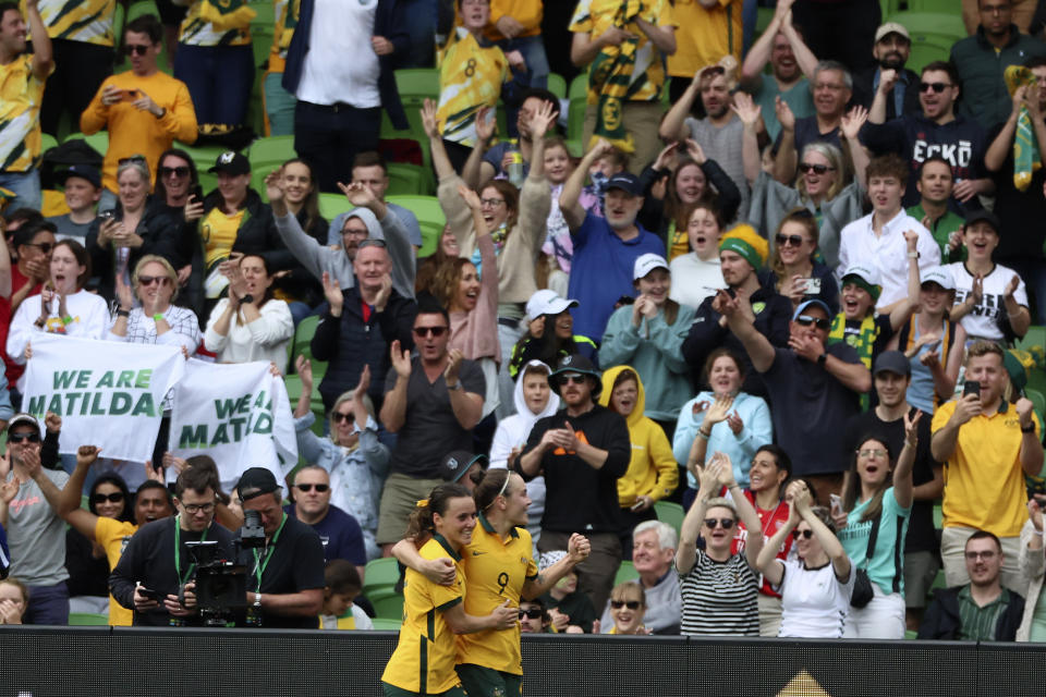 Australia's Caitlin Foord, bottom right, celebrates with teammate Hayley Raso after scoring her second goal against Sweden during their women's friendly soccer match in Melbourne, Australia, Saturday, Nov. 12, 2022. (Asanka Brendon Ratnayake)