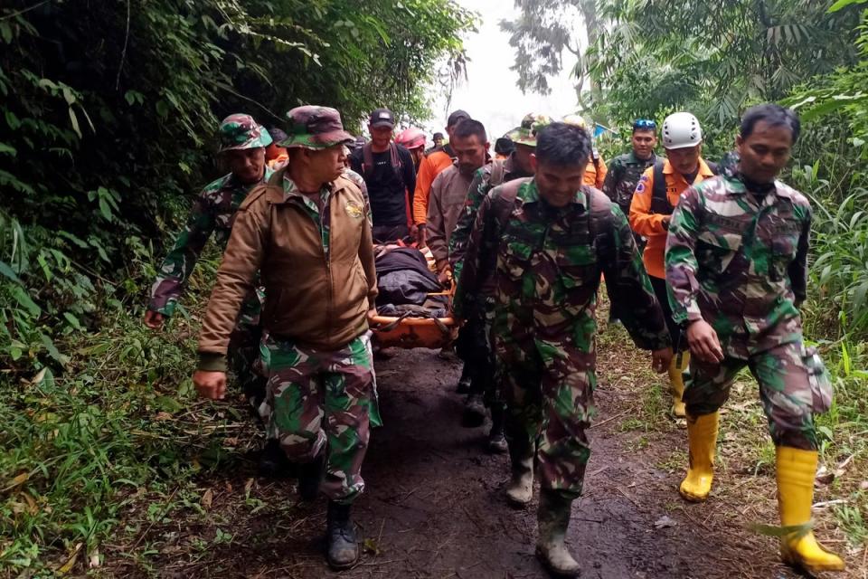Rescuers carry a climber injured in the eruption of Mount Marapi in Agam, West Sumatra (Copyright 2023 The Associated Press. All rights reserved.)