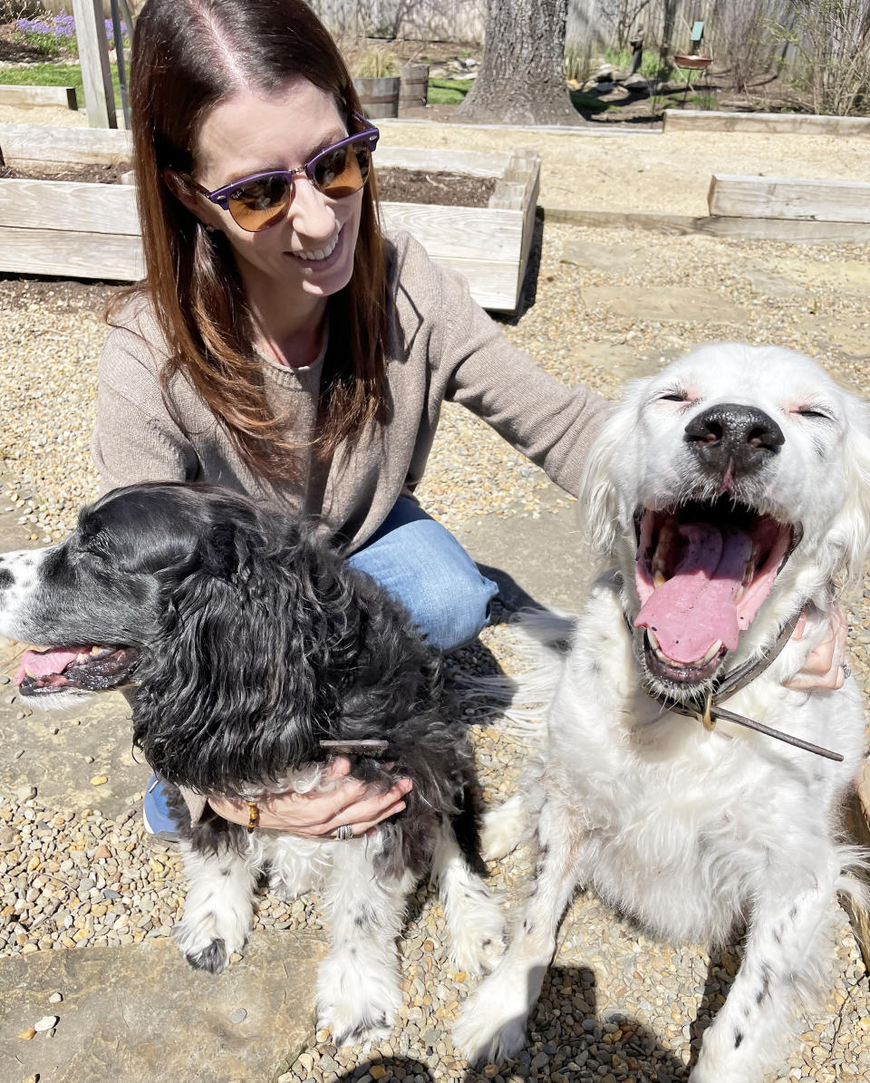 Emily Walthall, now 40, shares a happy moment with her dogs. (Courtesy Emily Walthall)