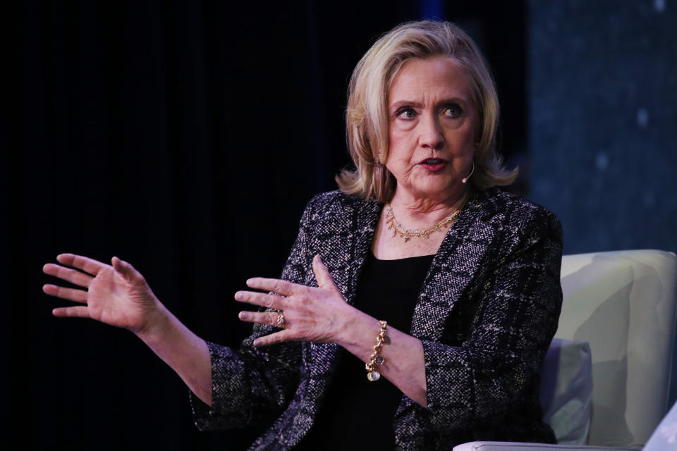 Former Secretary of State Hillary Clinton gestures as she speaks.