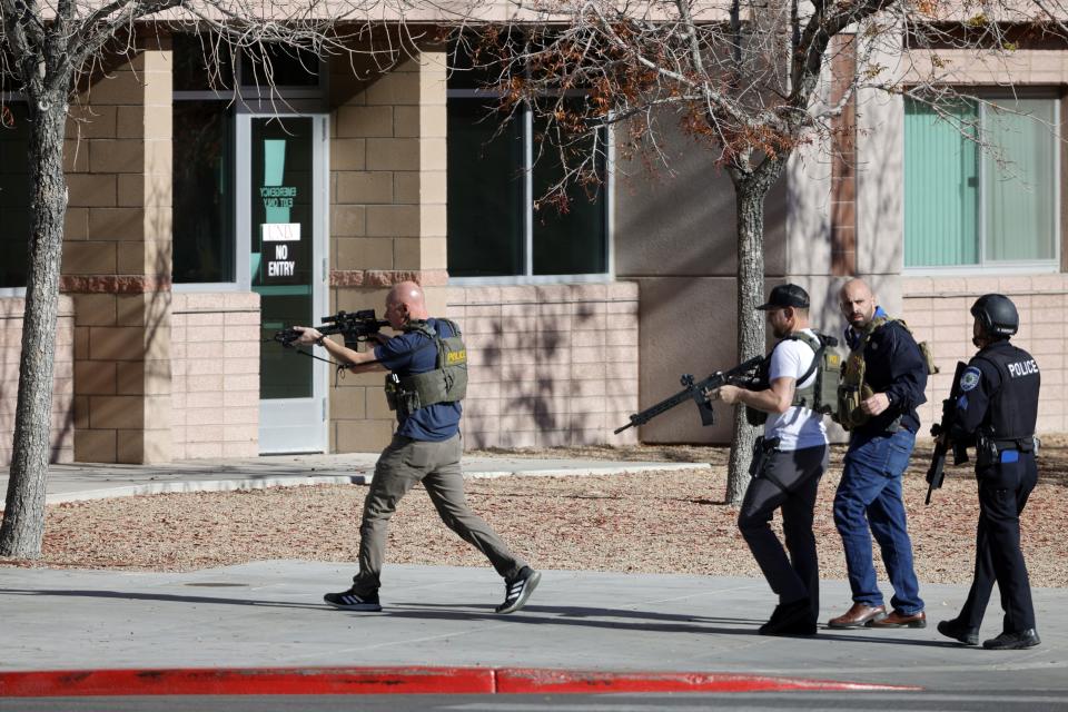 Law enforcement officers head into the University of Nevada, Las Vegas, campus after reports of an active shooter, Wednesday, Dec. 6, 2023, in Las Vegas. | Steve Marcus, Las Vegas Sun via AP