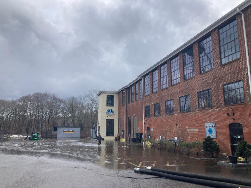 The Pawtuxet River once again overflowed its banks near the Pontiac Mills in Warwick, causing flooding at Apponaug Brewing Co., which already sustained damage from a previous storm.