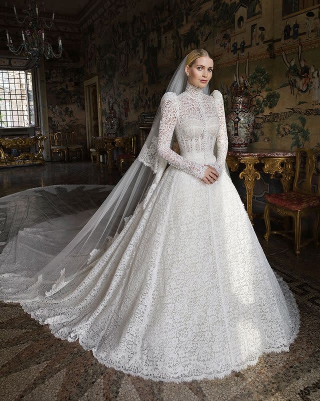 <p>The blonde looked regal in a lace Victoriana-inspired gown that featured a high neck, corseted bodice and puff sleeves as well as a Cathedral-length train for her nuptials in Rome.</p><p><a href="https://www.instagram.com/p/CRwK4gnNd-H/" rel="nofollow noopener" target="_blank" data-ylk="slk:See the original post on Instagram;elm:context_link;itc:0;sec:content-canvas" class="link ">See the original post on Instagram</a></p>